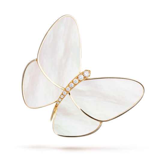 This is a gold, mother-of-pearl, and diamond brooch from Van Cleef & Arpels' Butterfly collection.